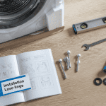 installer machine à laver vue accessoires outils